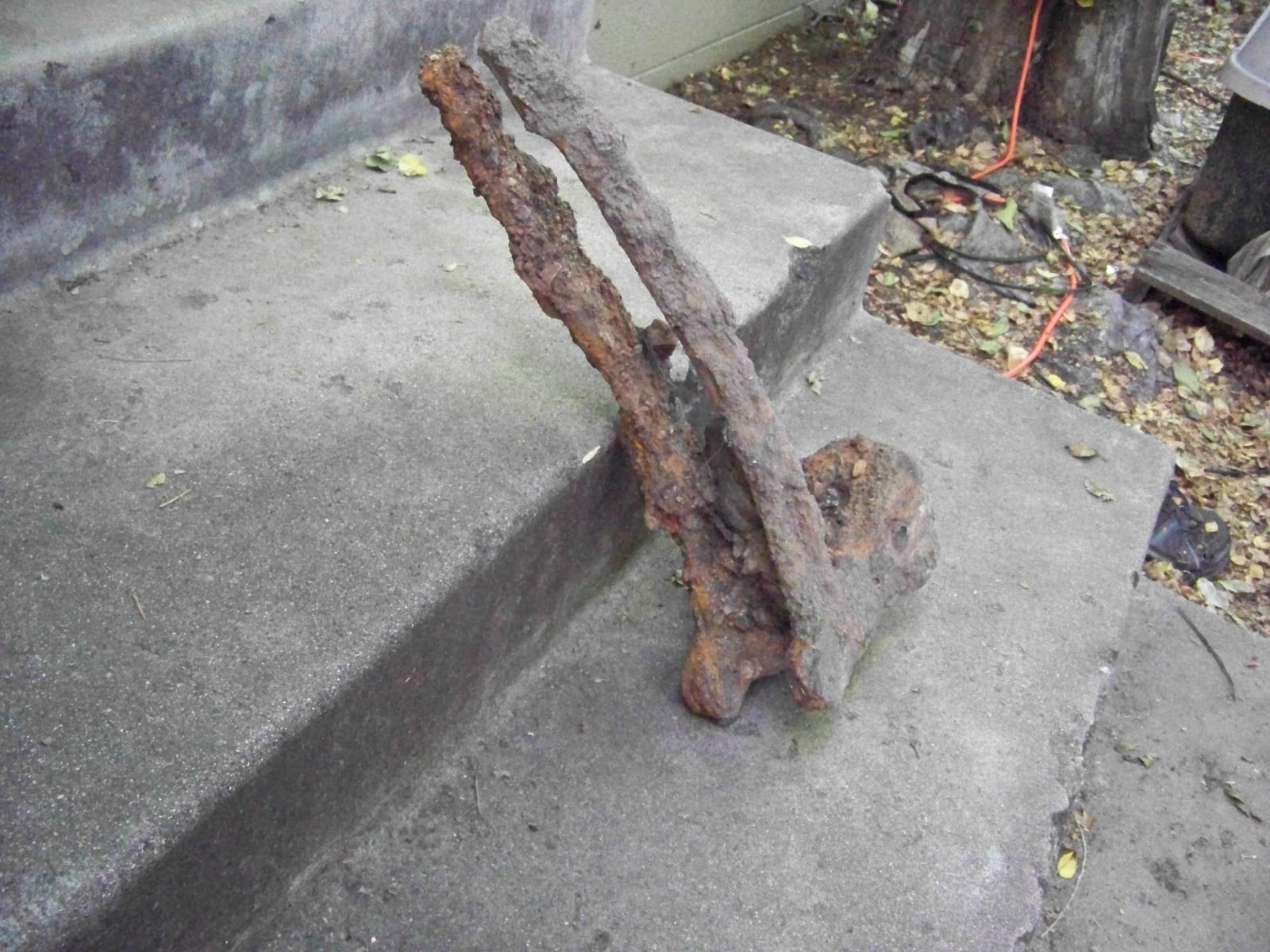 Heavily rusted wrought iron or cast iron hardware fragment