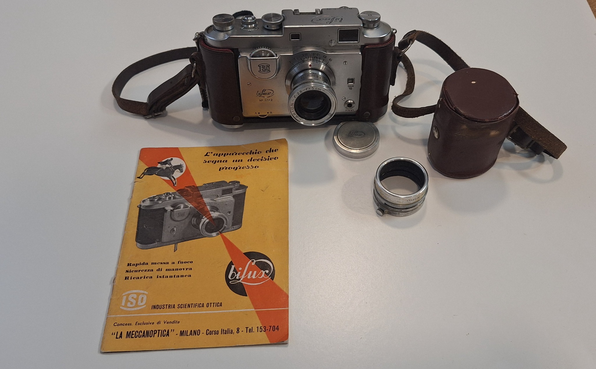 ISO Biflux 35mm rangefinder camera with leather case, lens, and manual