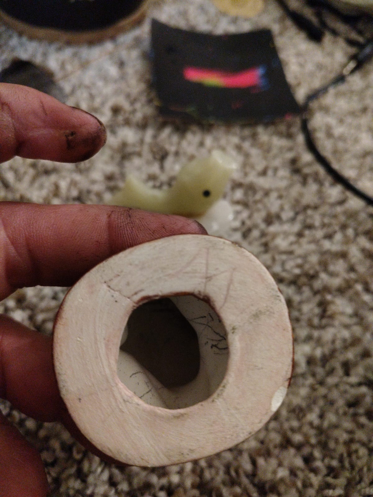 Carved bone or ivory ring-shaped object (possibly a bead, spacer, or component from a decorative item)