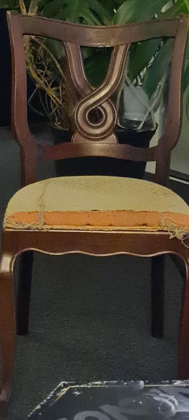 Wooden upholstered side chair with decorative splat back