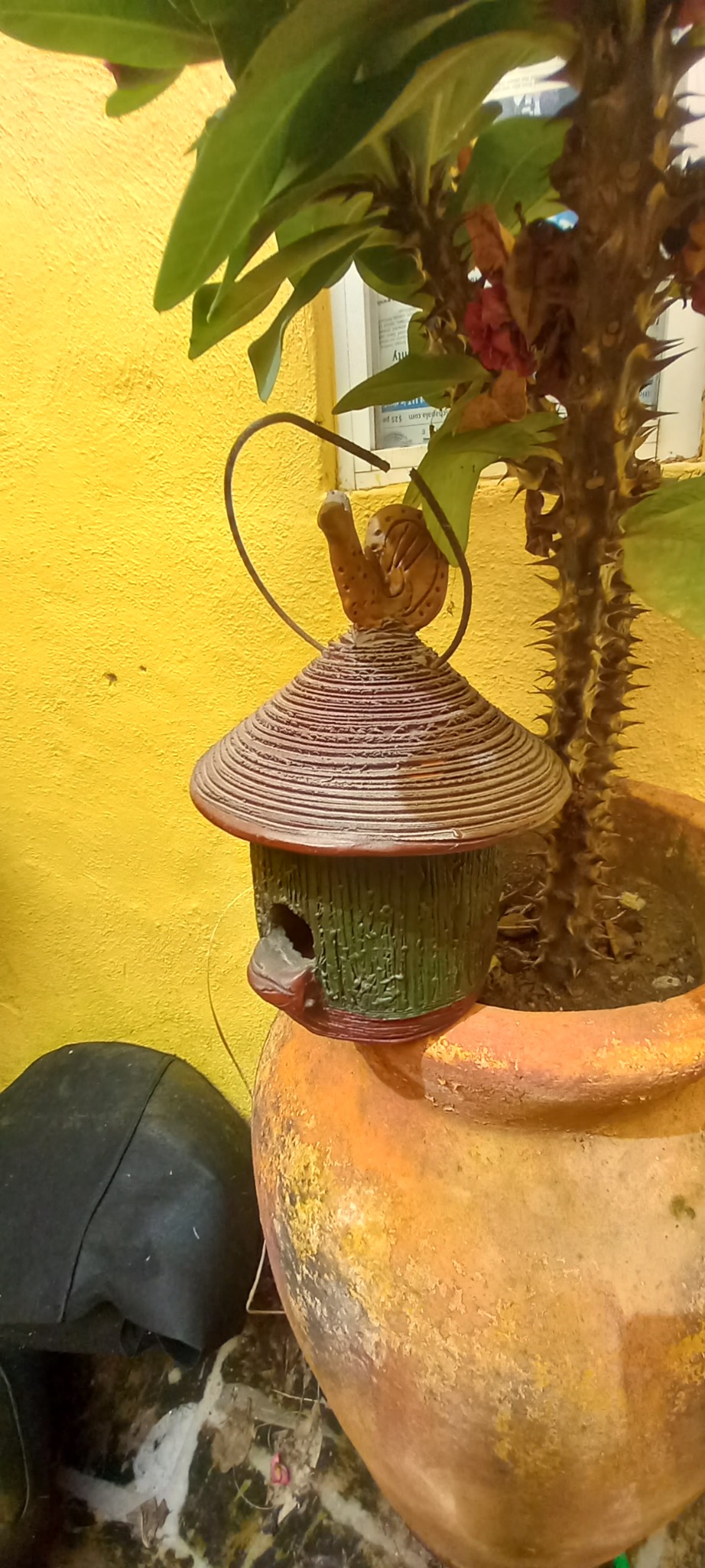 Decorative hanging birdhouse or garden ornament