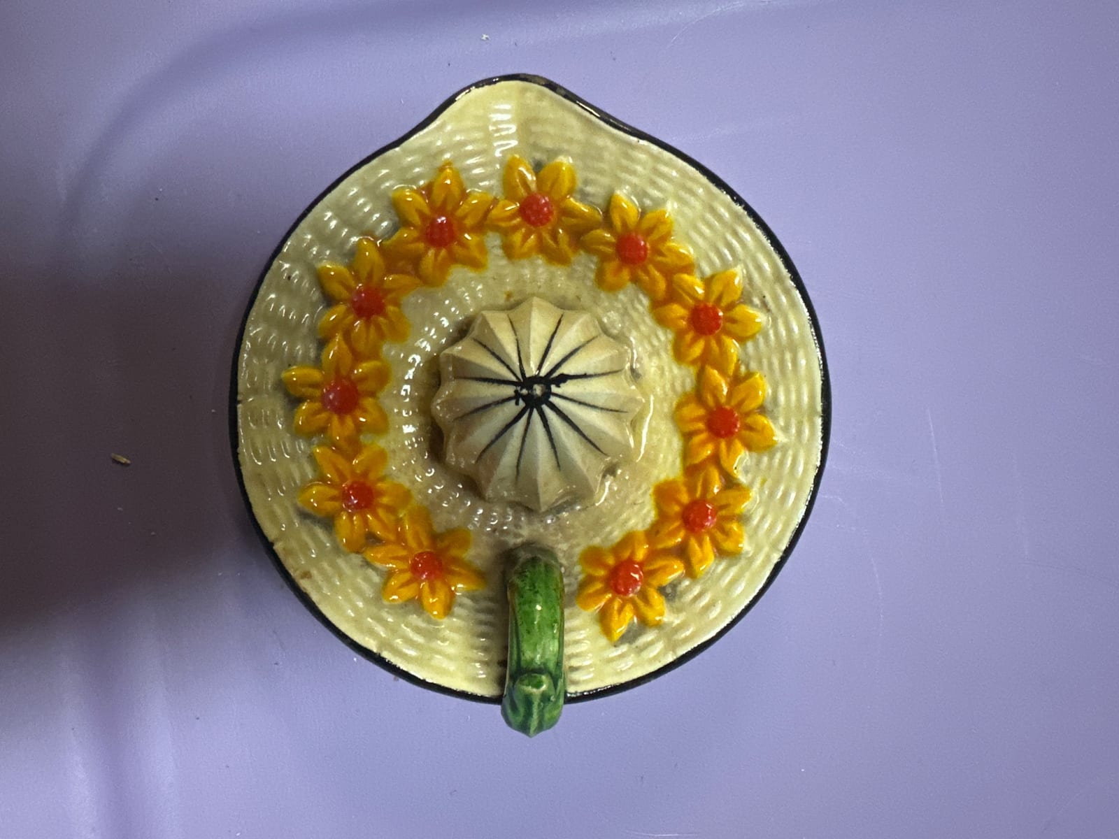 Decorative ceramic wall plaque or trinket dish with floral motif