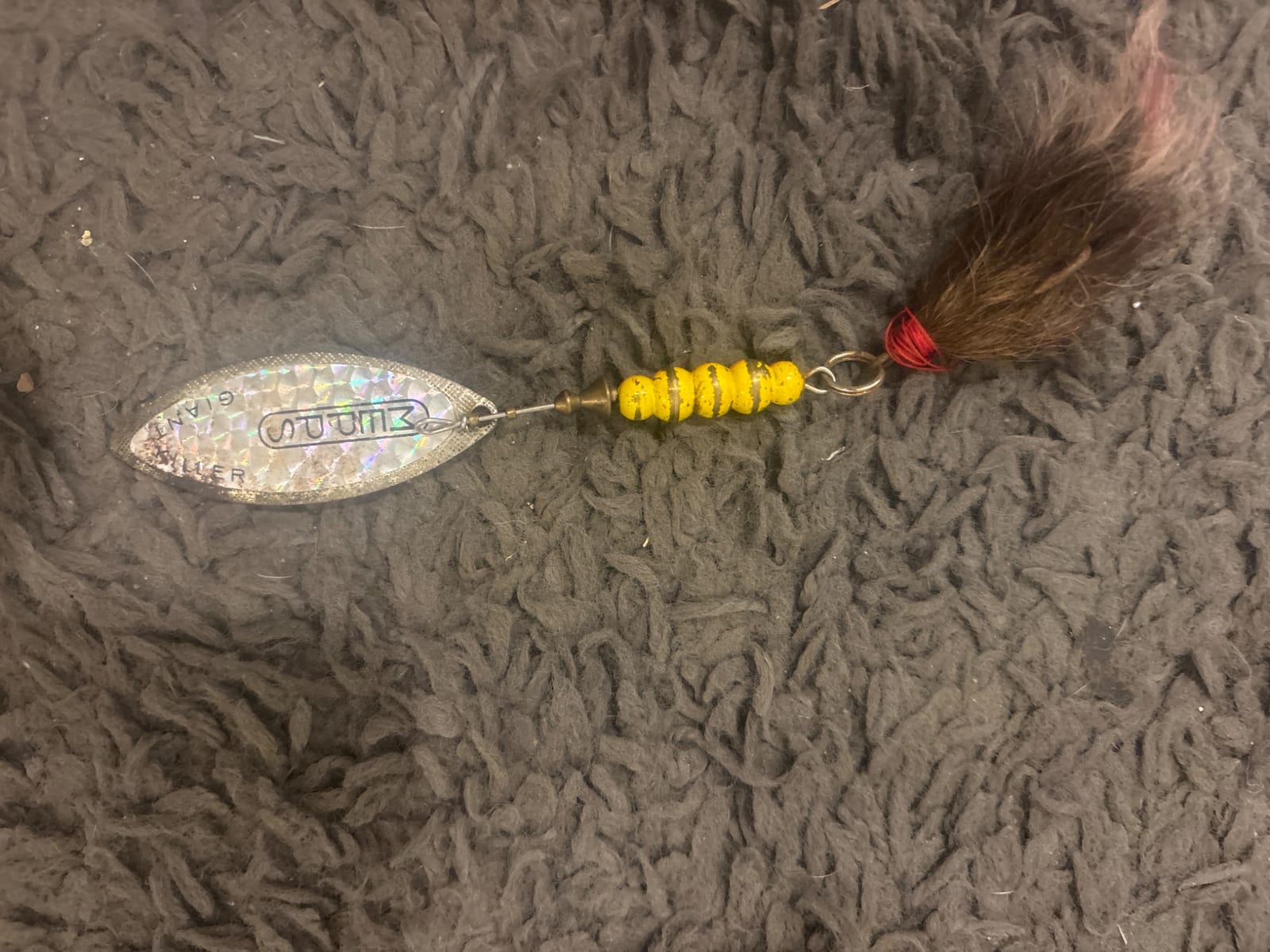 Vintage fishing spinner lure with bucktail tail
