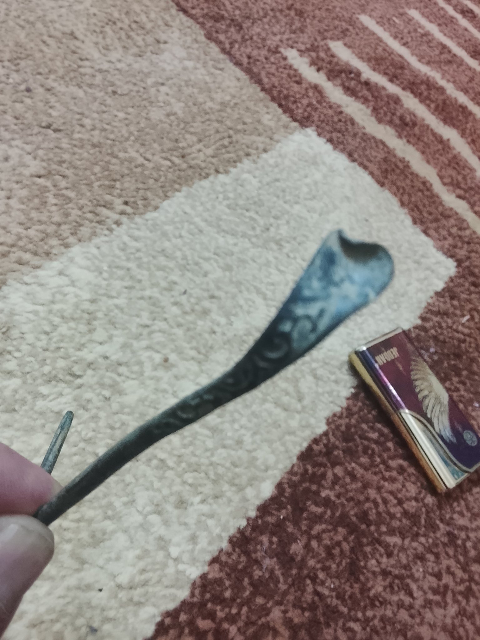 Decorative metal spoon or ladle handle fragment