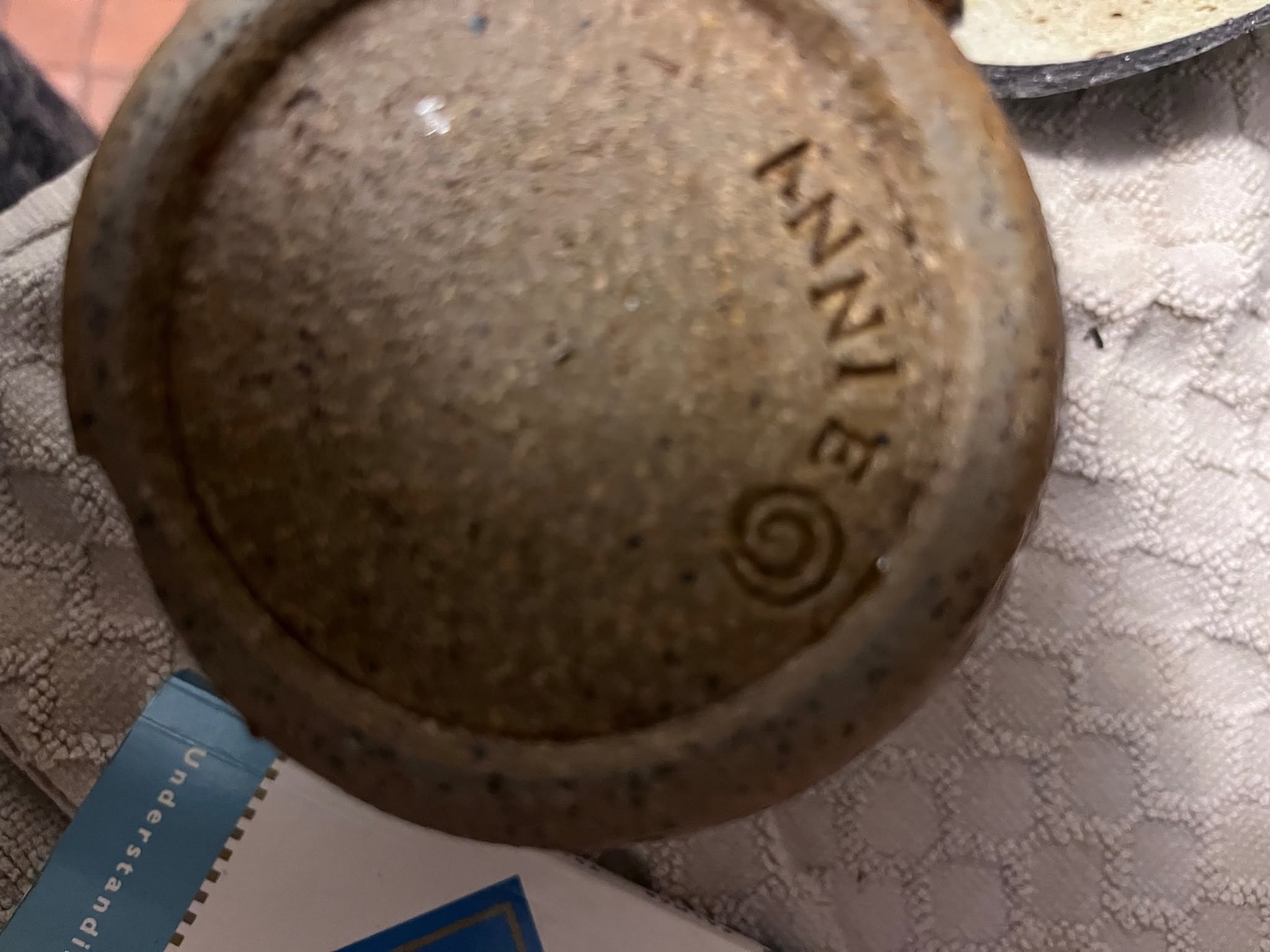 Cast metal or stoneware vessel lid / cover (possibly from a jar, pot, or canister)
