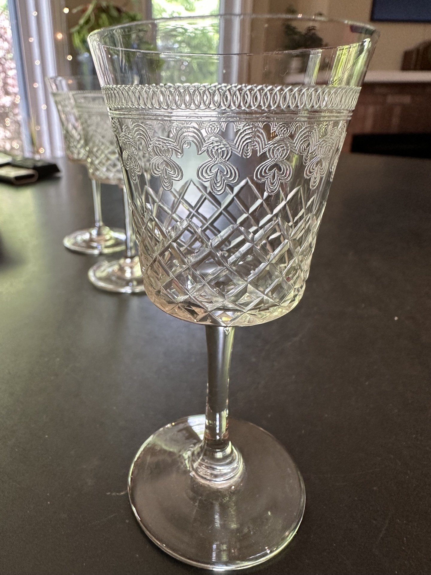 Cut crystal wine goblet with etched and cut geometric/floral decoration