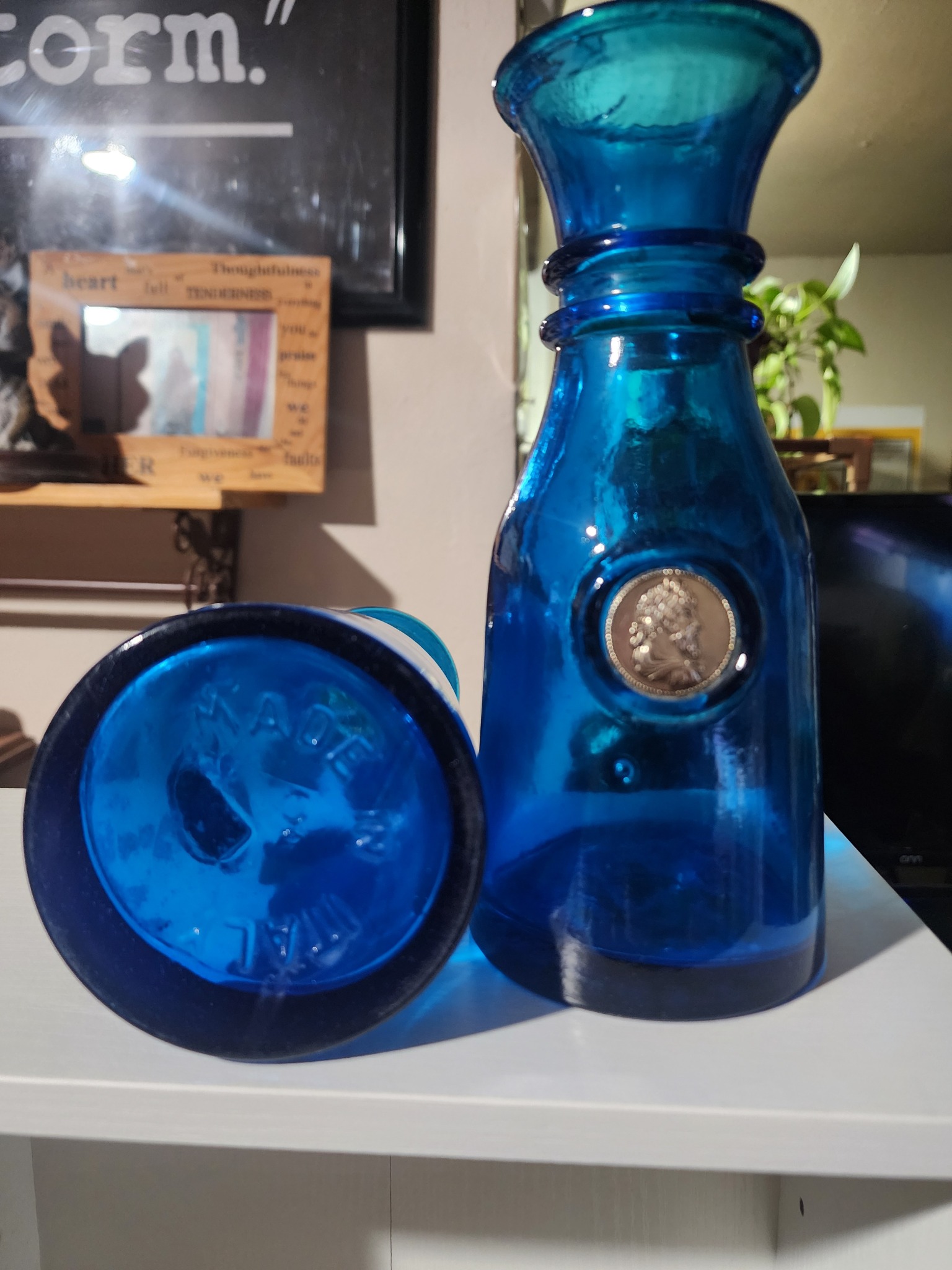 Blue pressed-glass decorative bottle or vase with medallion portrait
