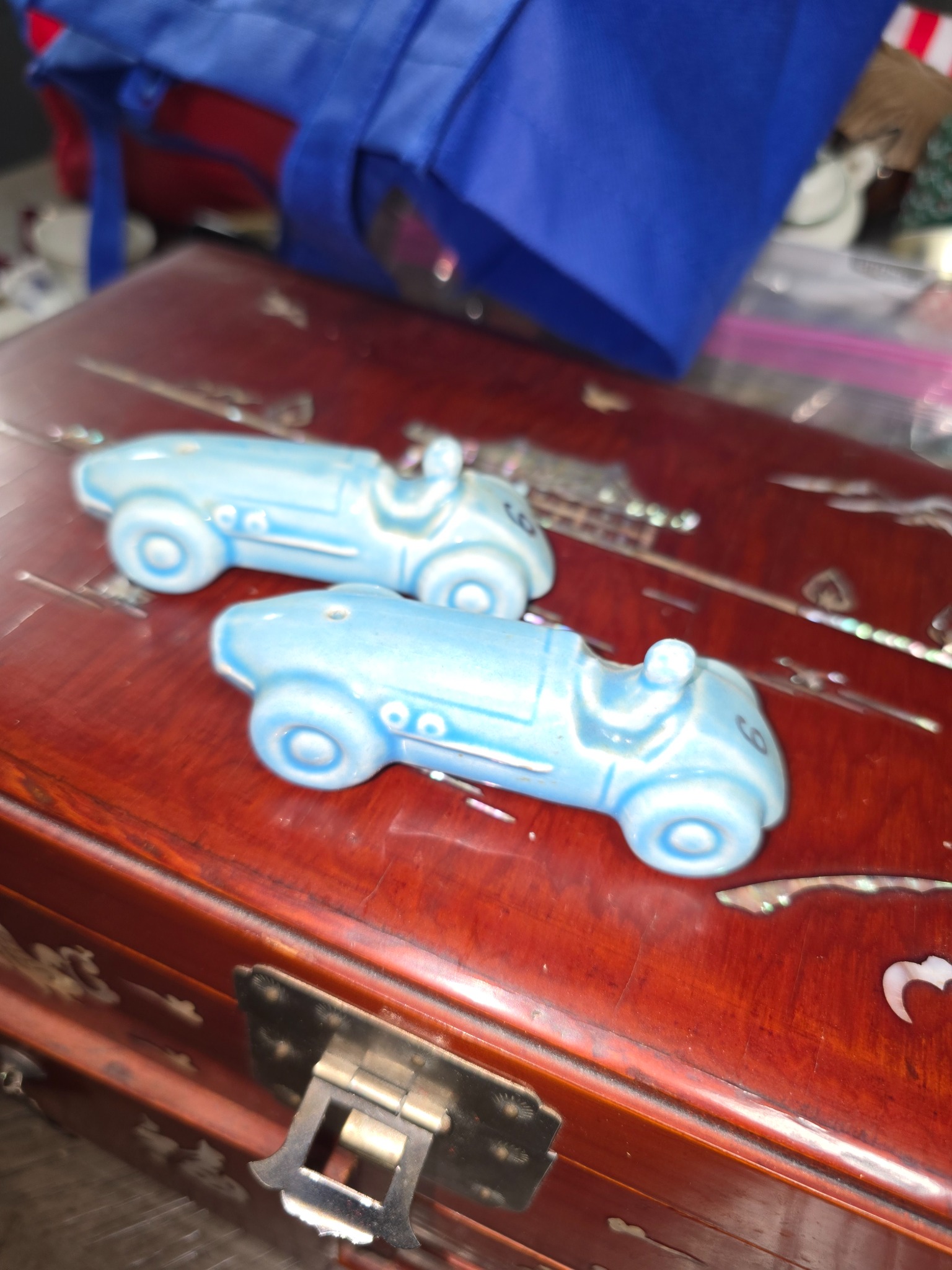Pair of ceramic race car figurines