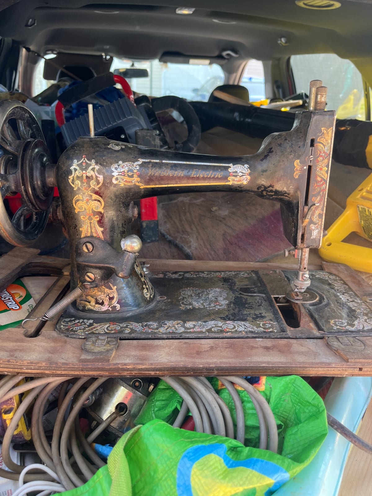 Vintage treadle sewing machine (likely domestic cast-iron machine, possibly Japanese or American-made)