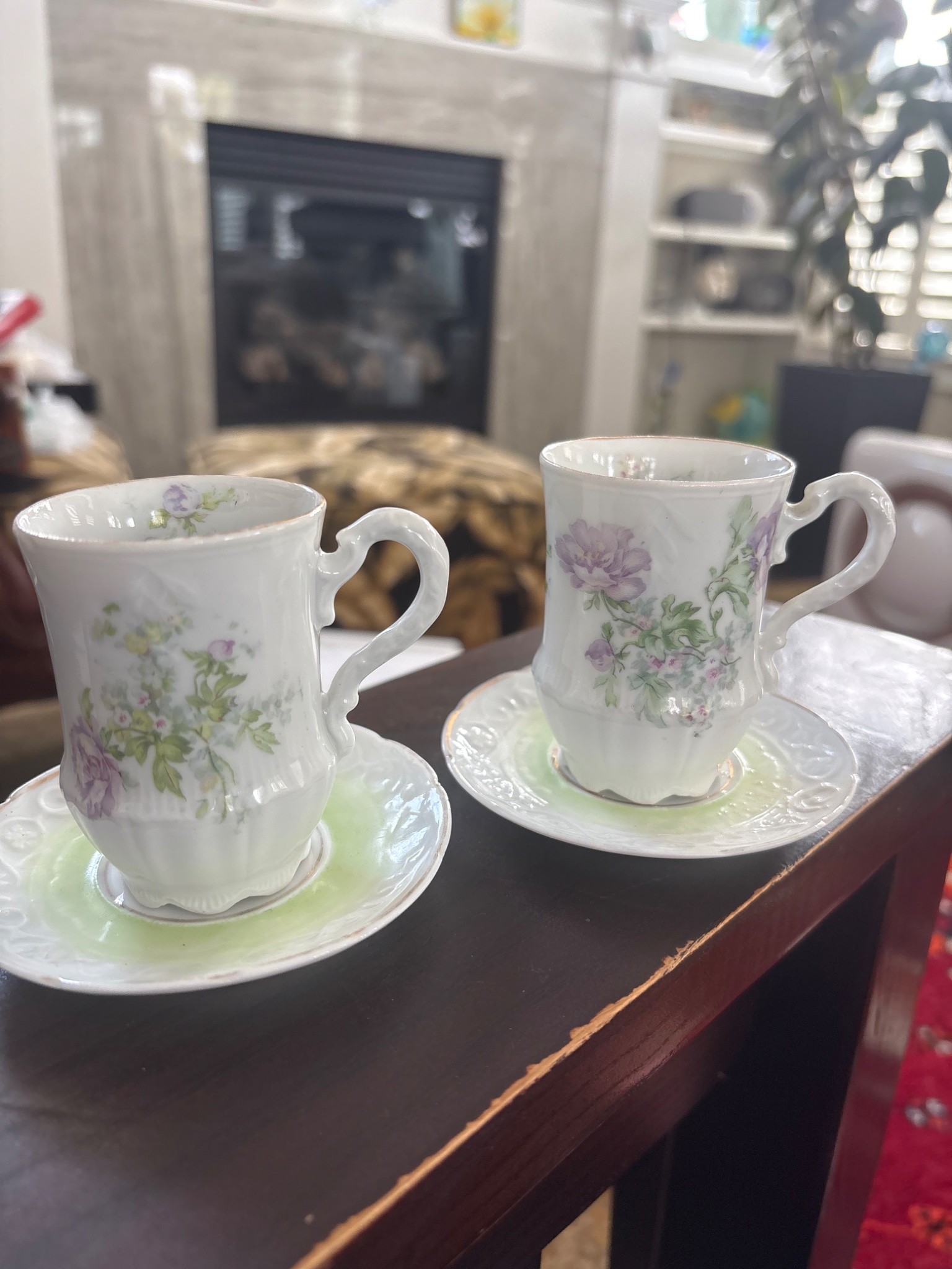 Pair of porcelain demitasse cups and saucers with floral decoration