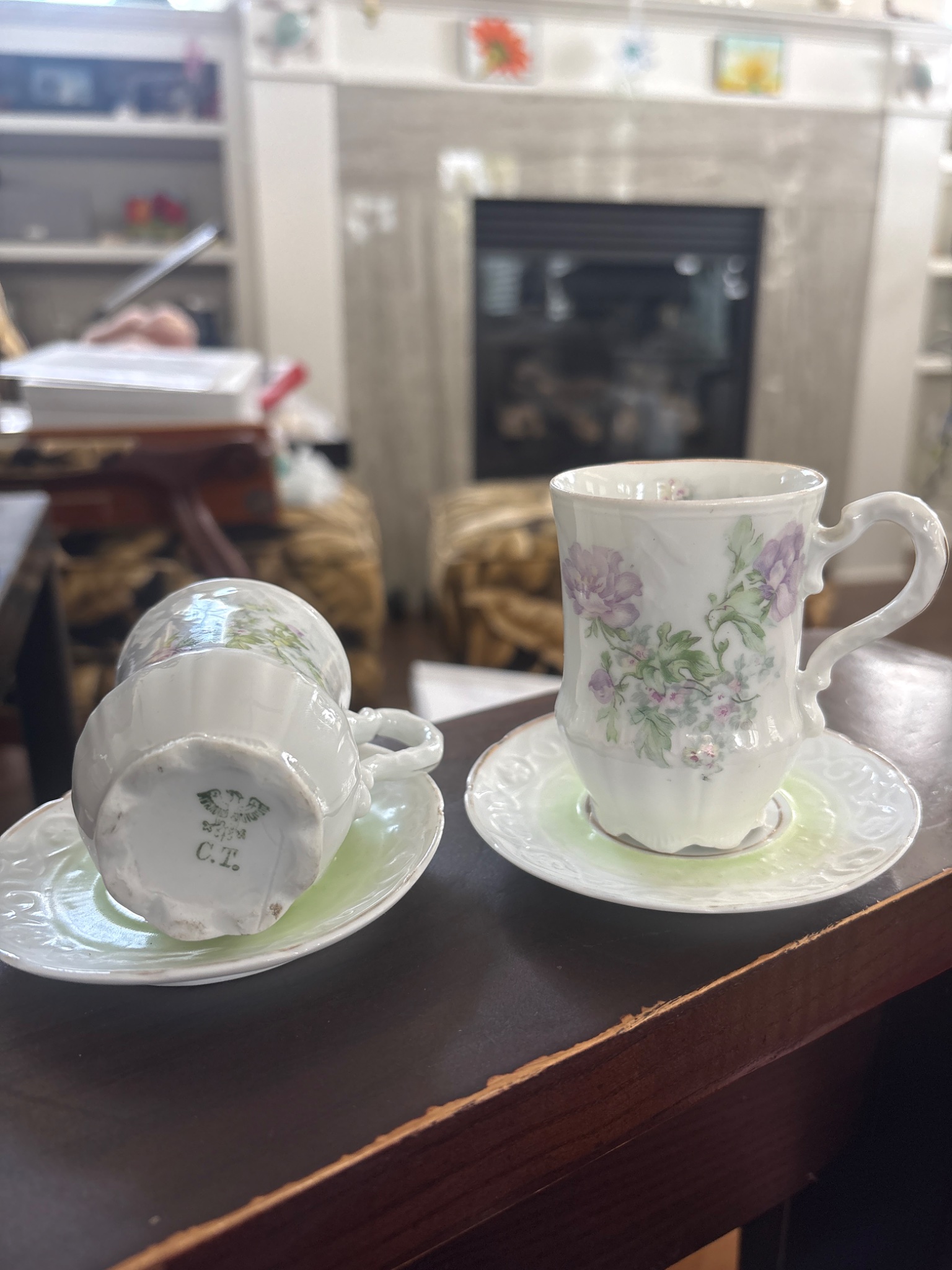 Pair of porcelain demitasse cups and saucers with floral decoration