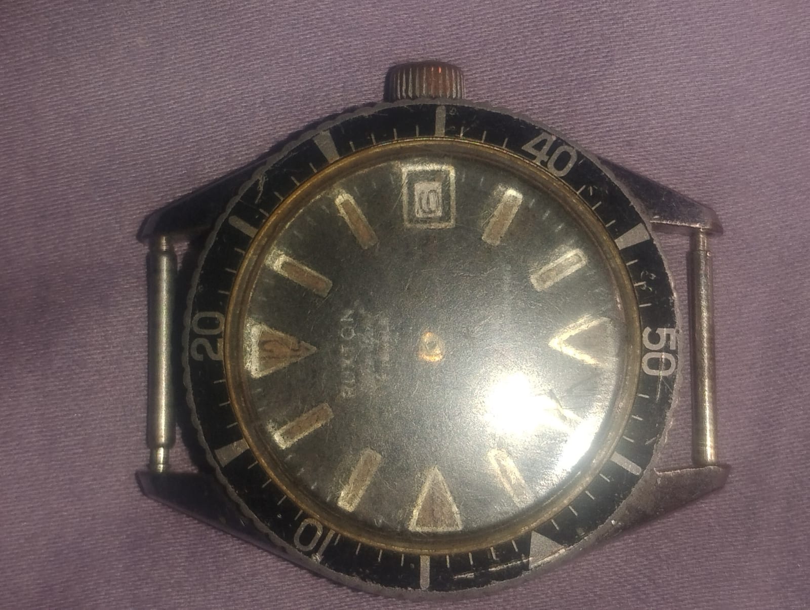 Vintage wristwatch case and dial assembly (likely a diver-style or rotating bezel watch)