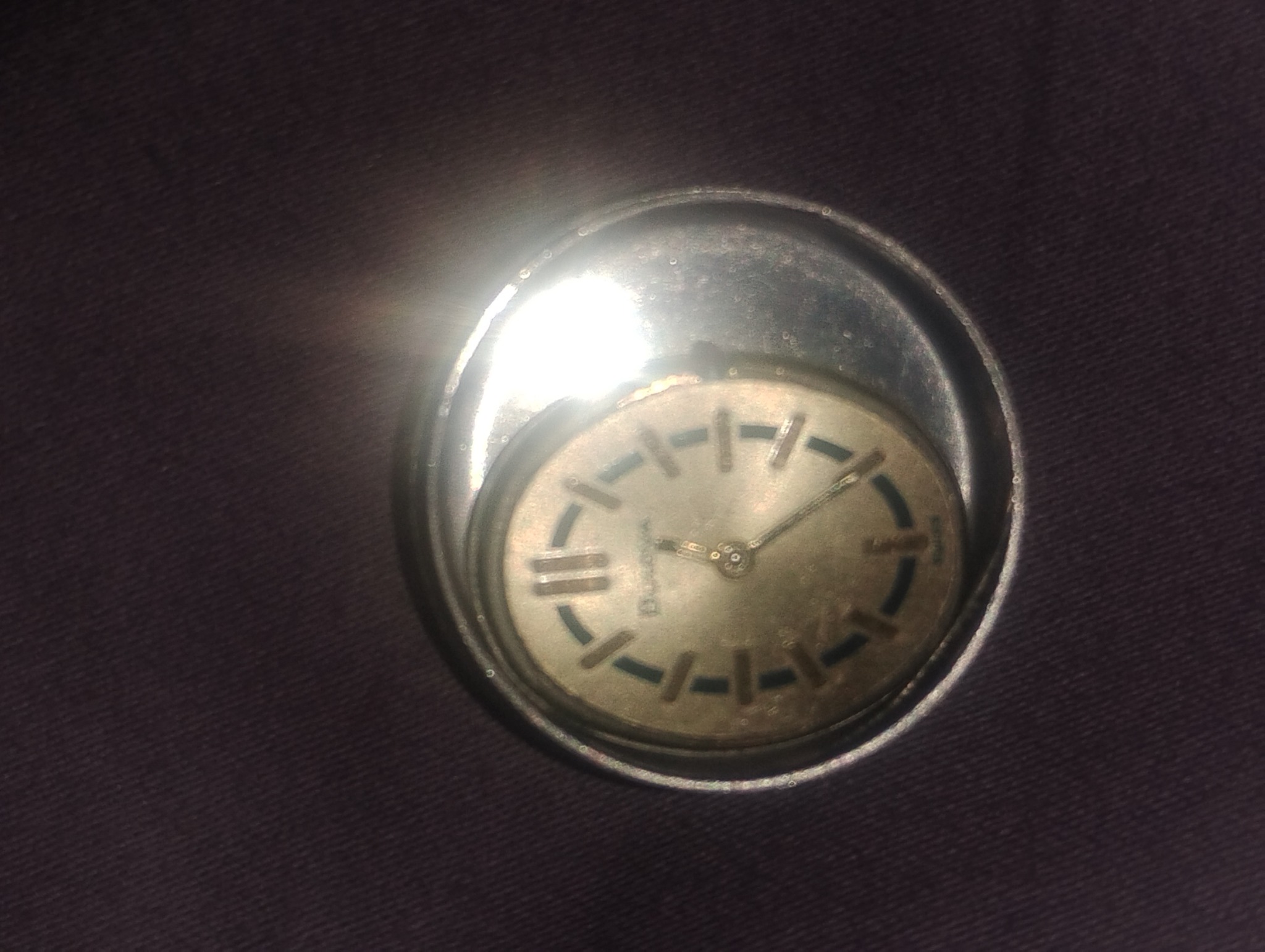 Vintage round analog wristwatch or pocket-watch style timepiece