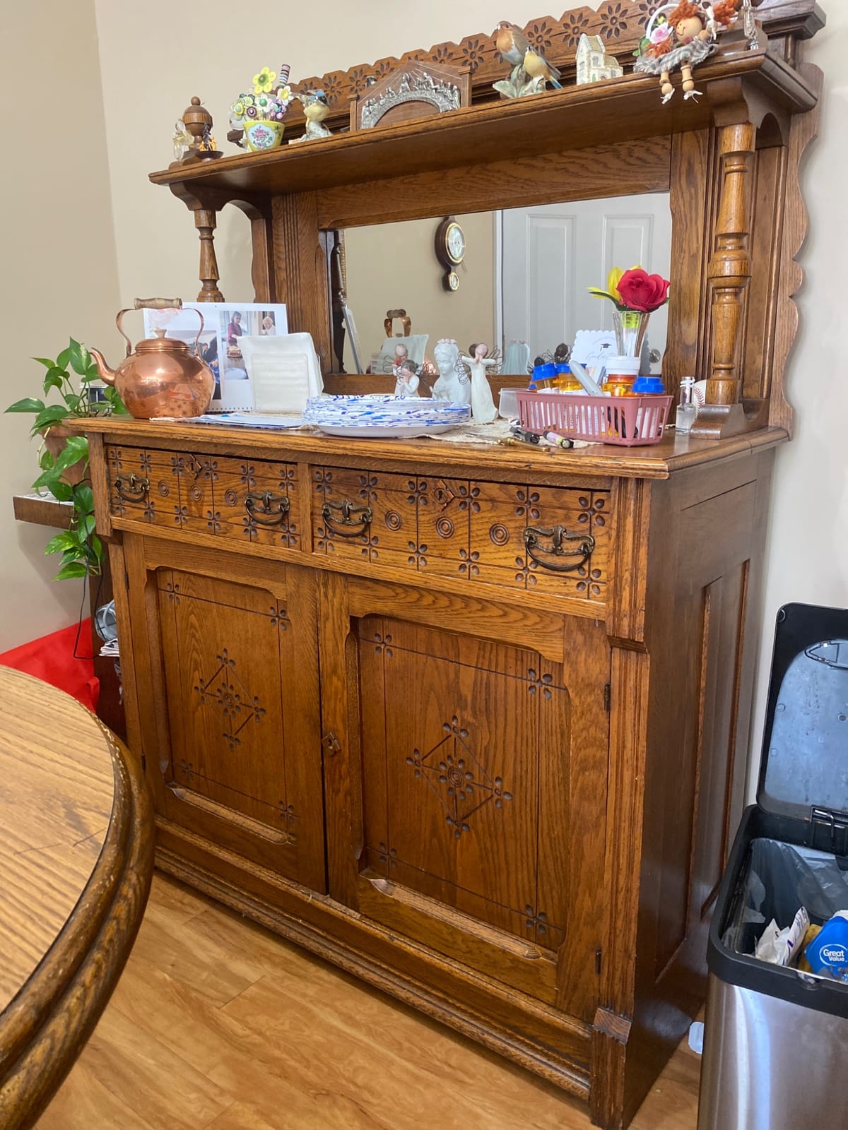 Oak sideboard or buffet with mirrored back and carved decorative panels