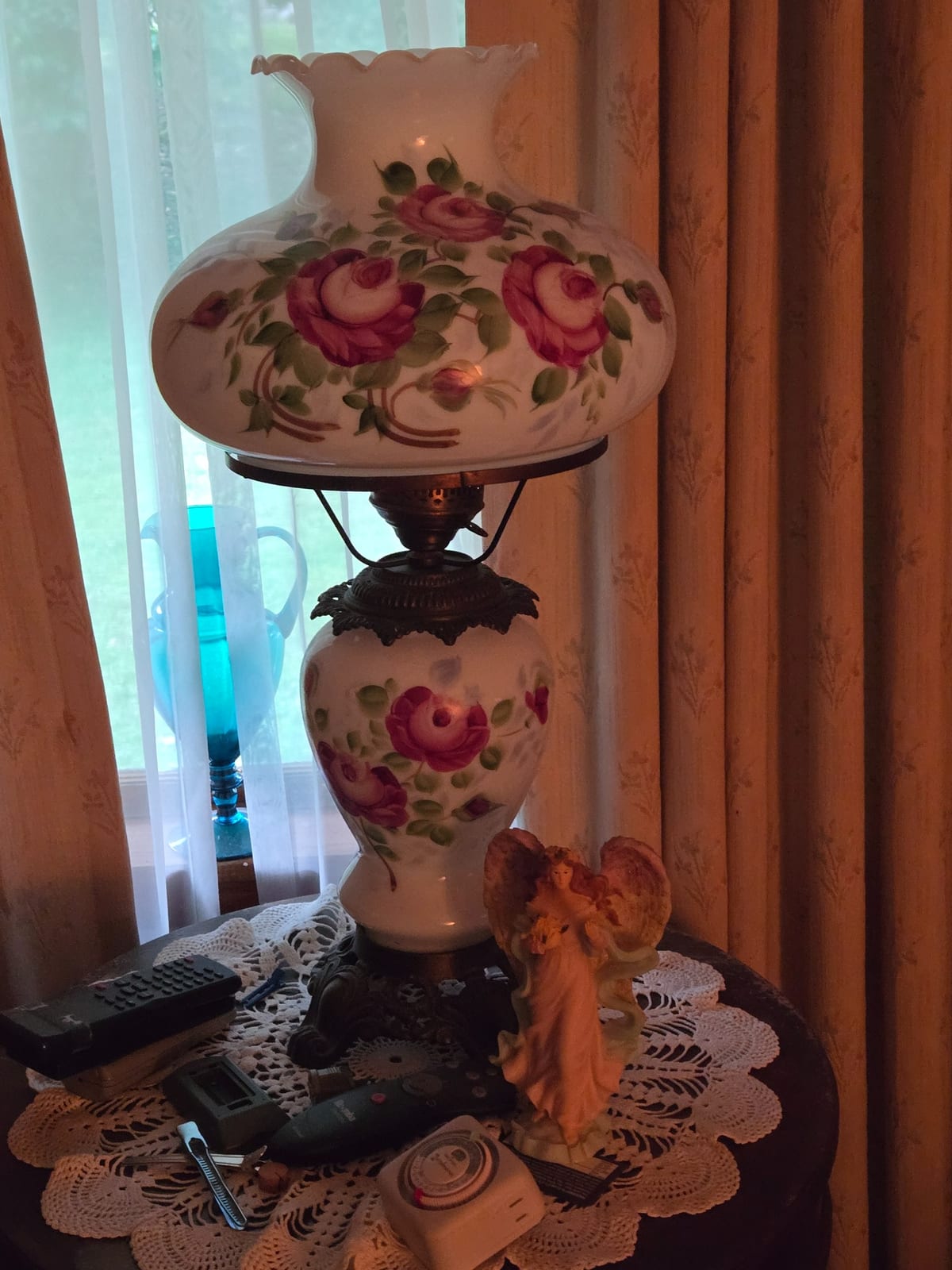 Victorian-style porcelain oil lamp with hand-painted floral decoration