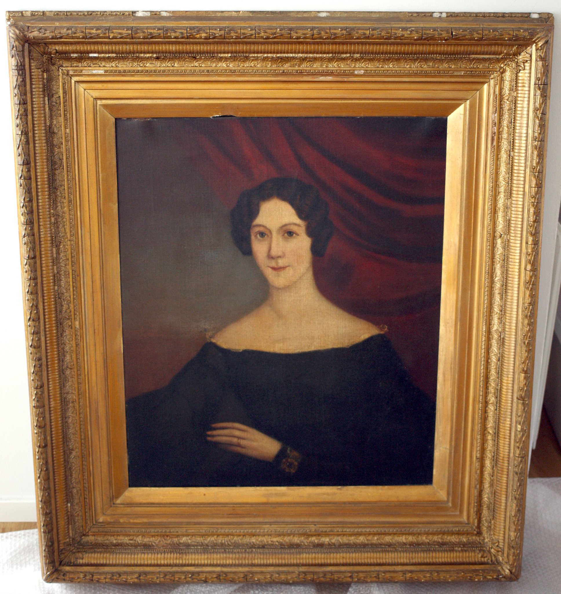 Framed portrait painting of a woman