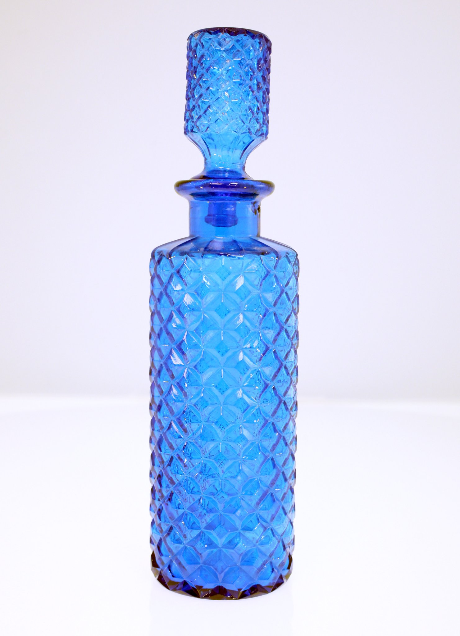 Blue pressed glass perfume bottle with stopper