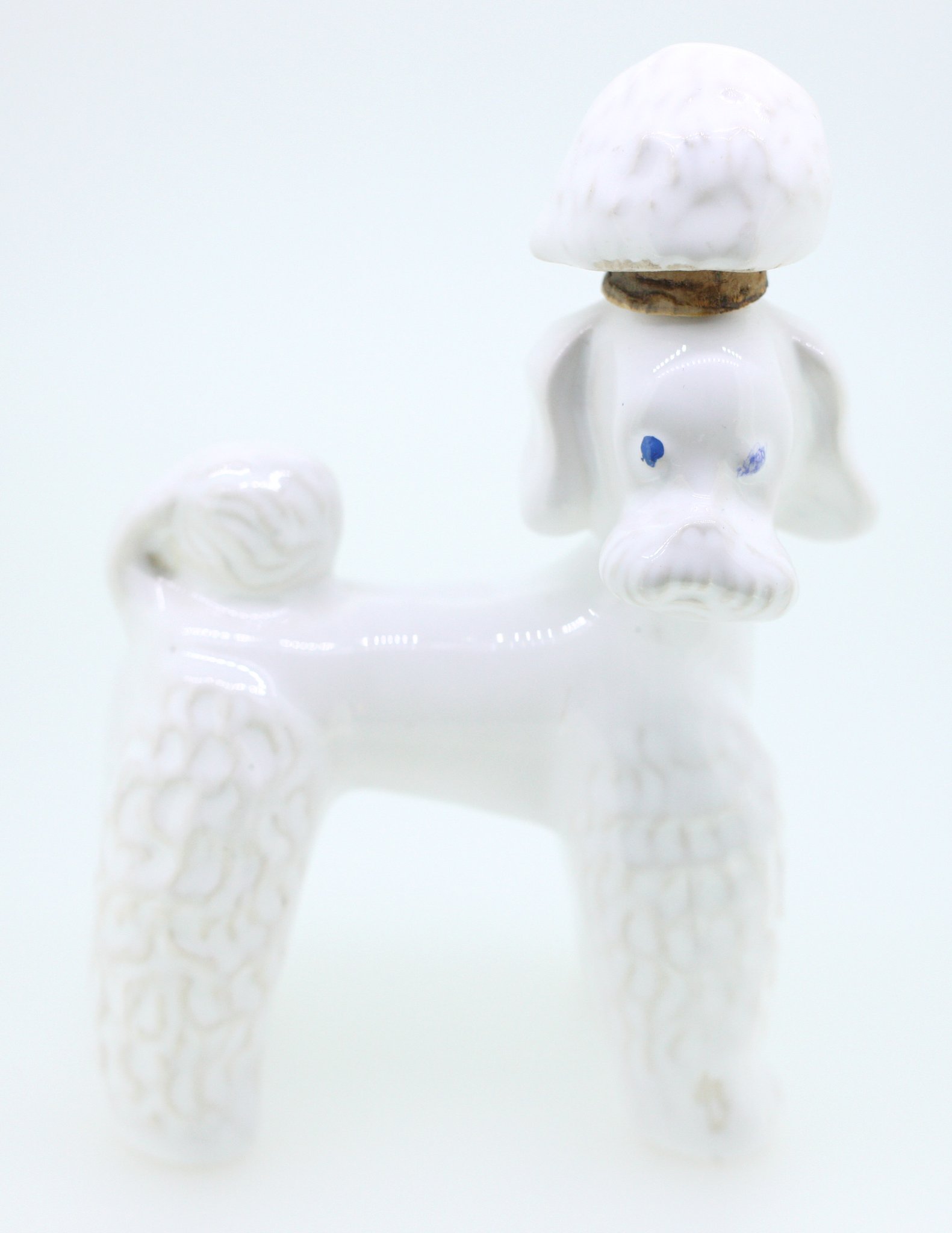 Small porcelain poodle figurine