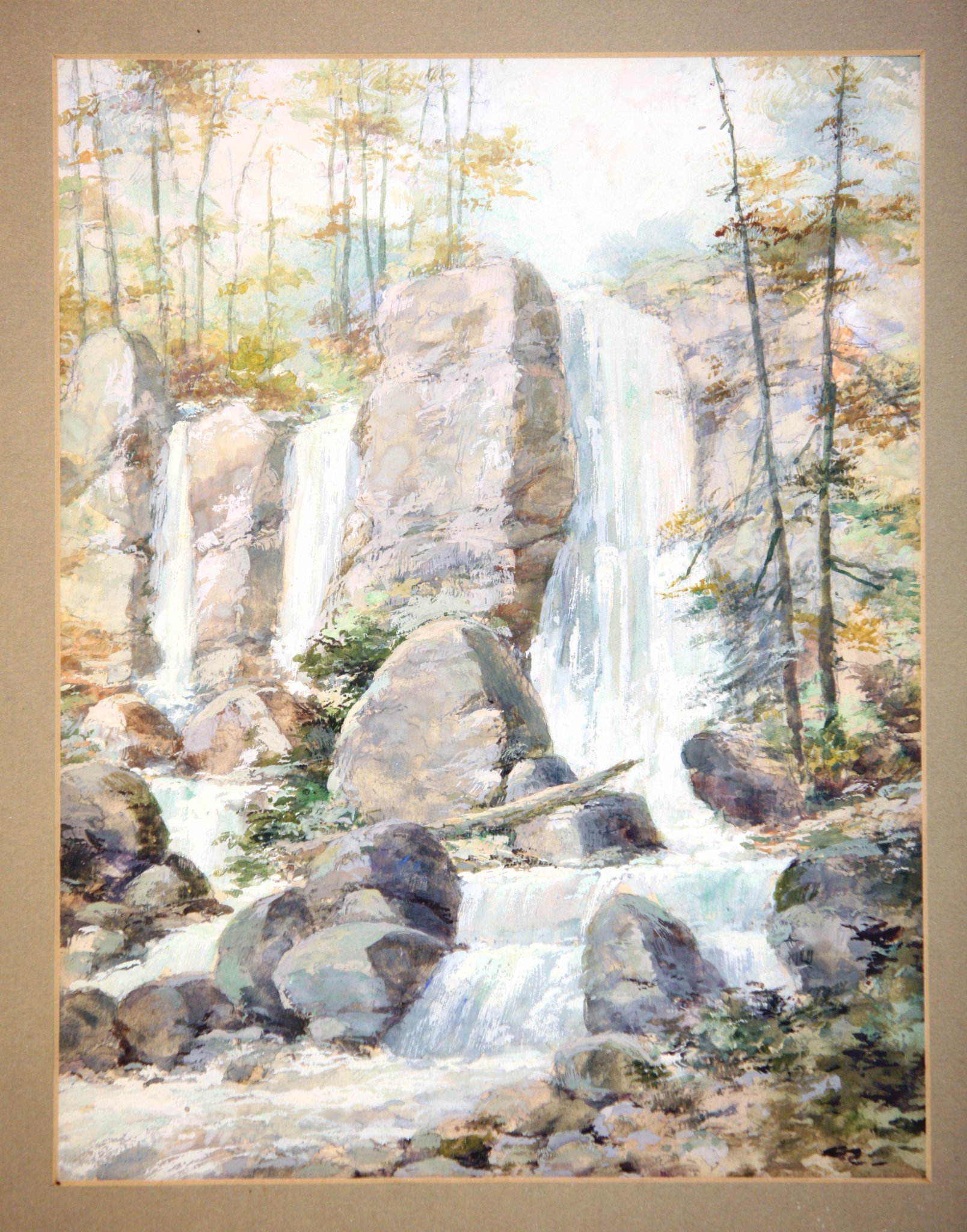 Framed watercolor landscape painting of a waterfall and forest scene