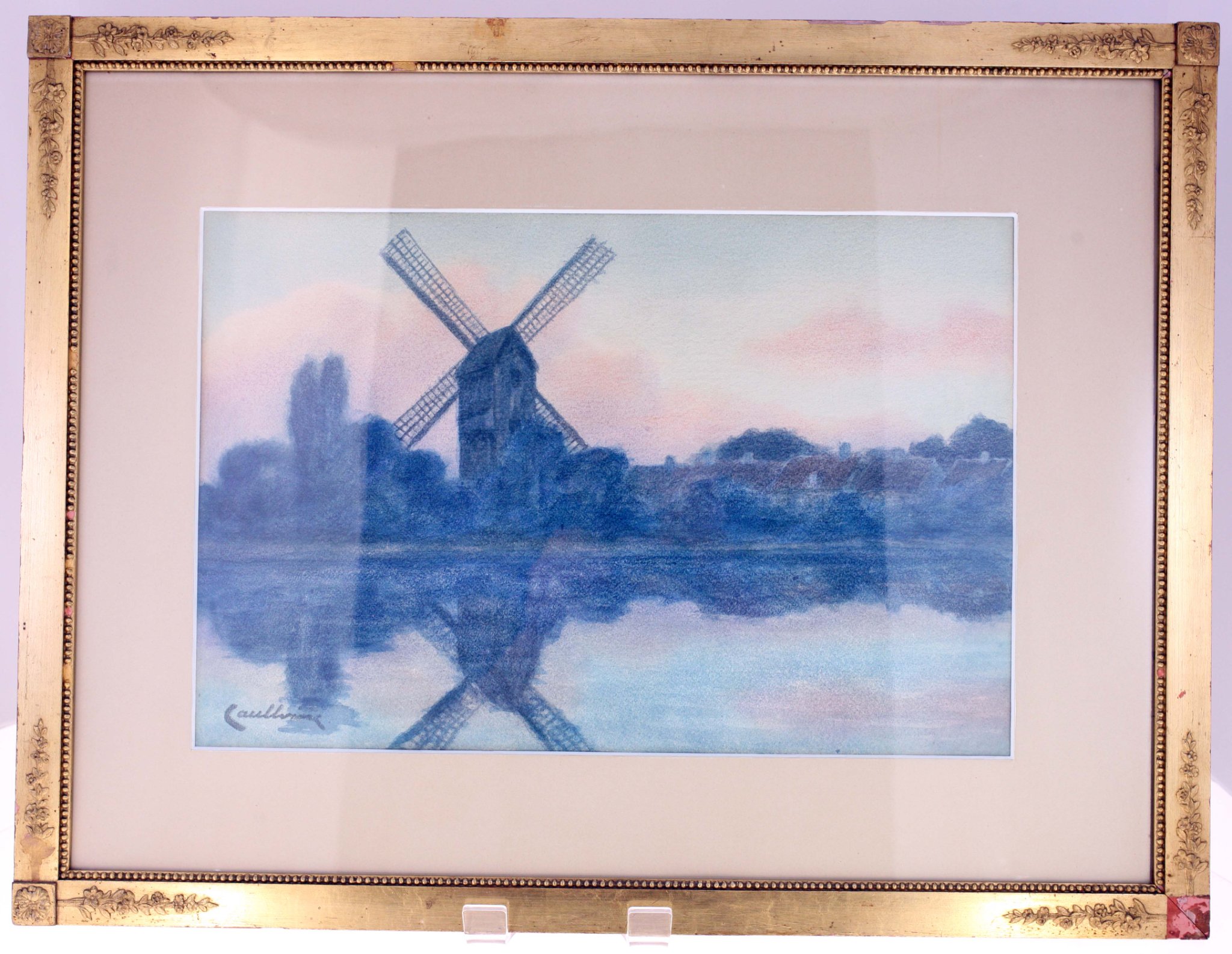 Framed landscape print or painting of a windmill
