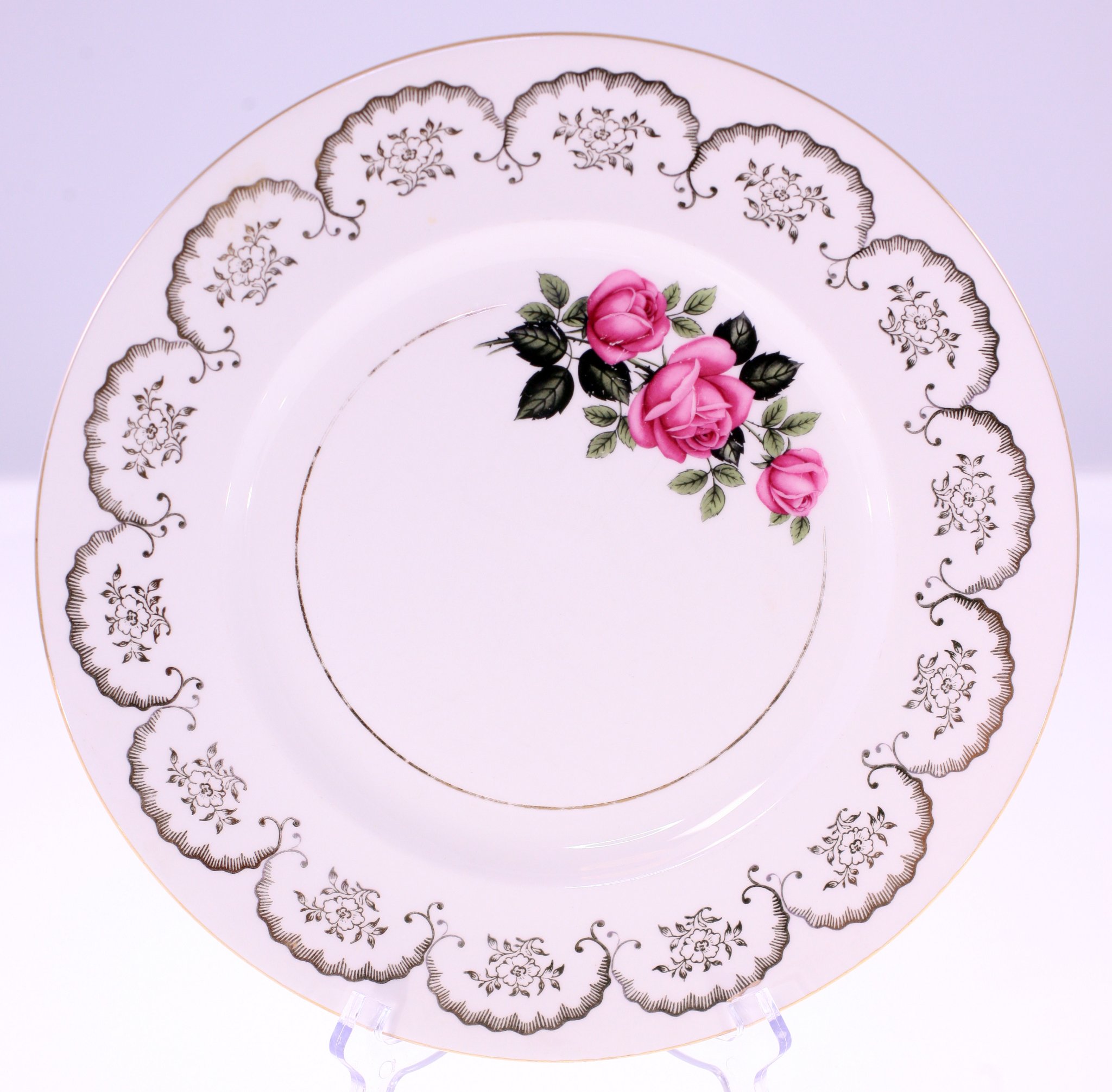 Decorative porcelain dinner plate with rose motif