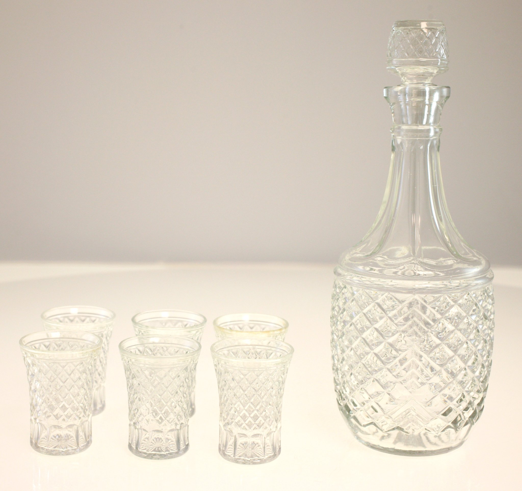 Cut glass decanter set with matching shot glasses