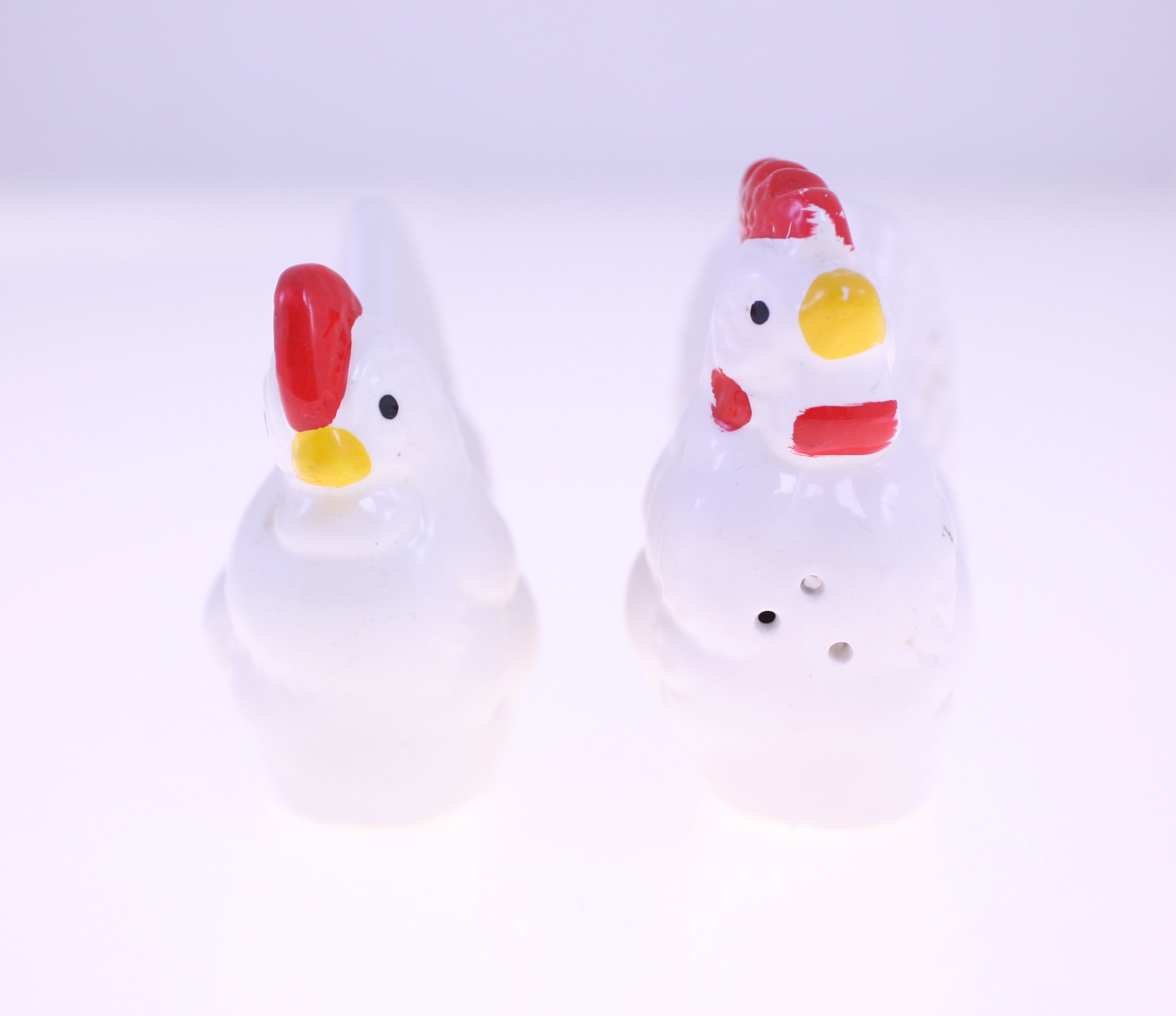 Pair of small hand-painted glass chicken figurines