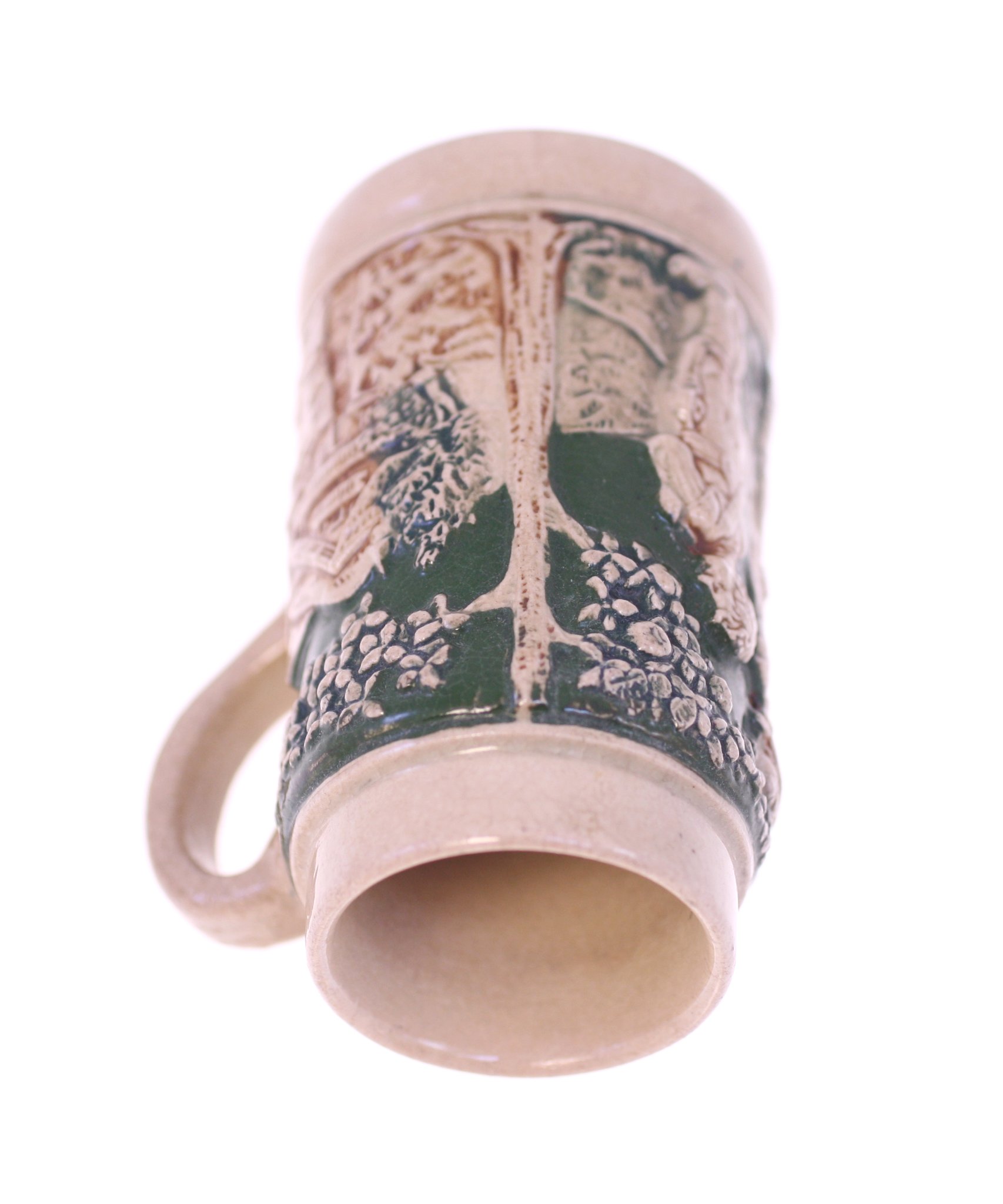 Ceramic beer stein / tankard with relief forest or wildlife motif
