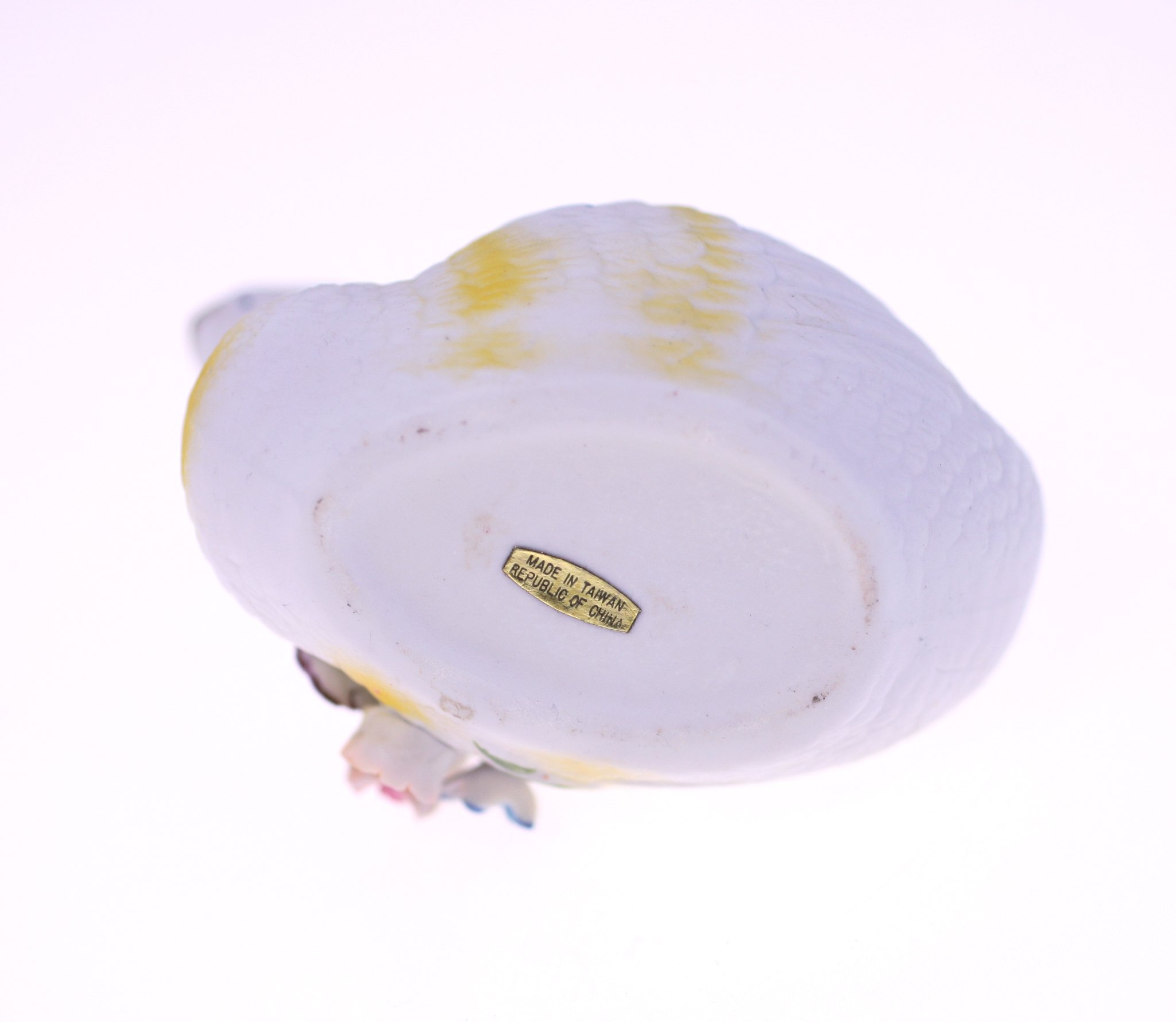 Porcelain bird figurine (likely a small decorative bird, possibly a dove or chick)