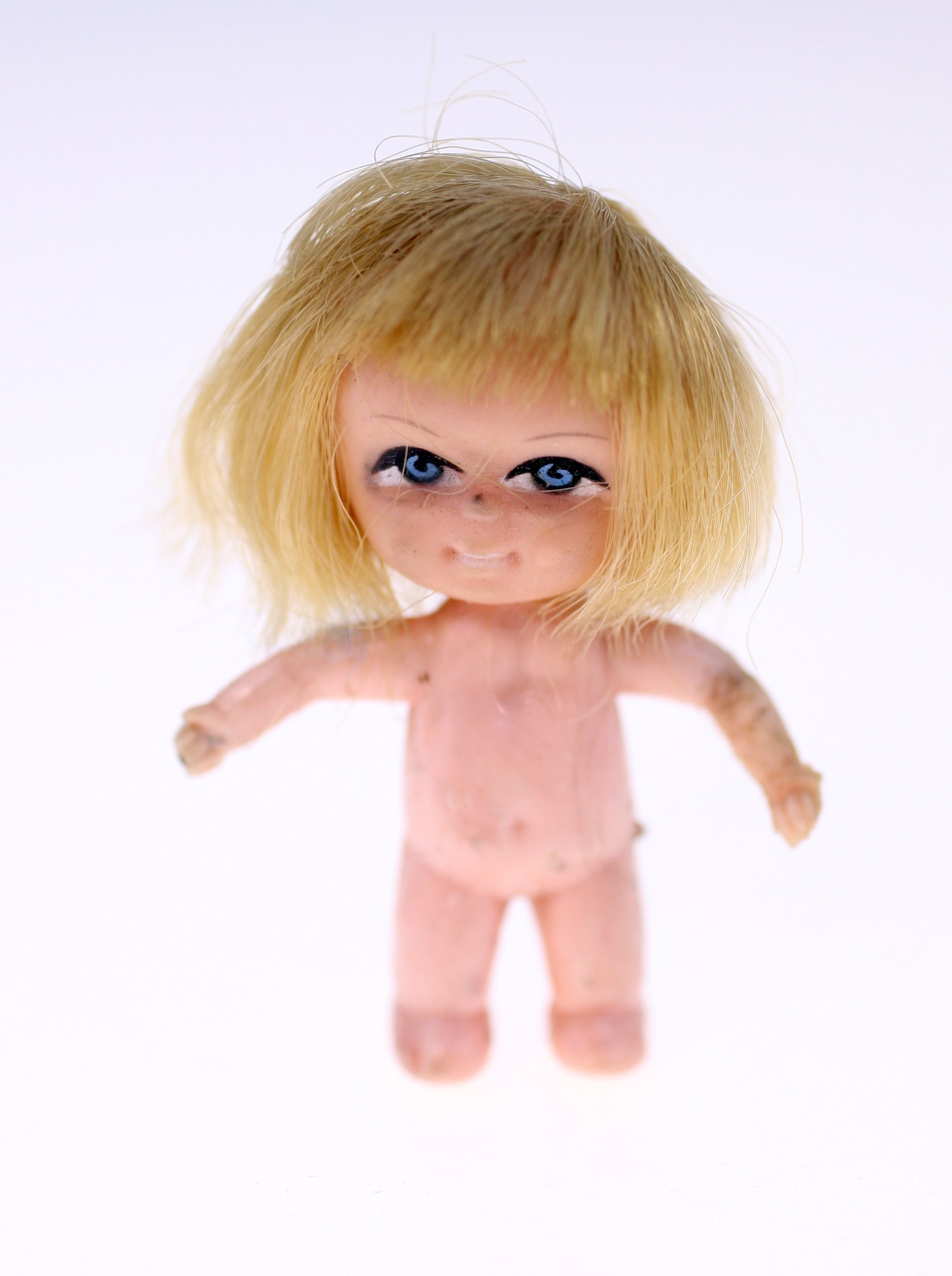 Small vintage plastic doll figure