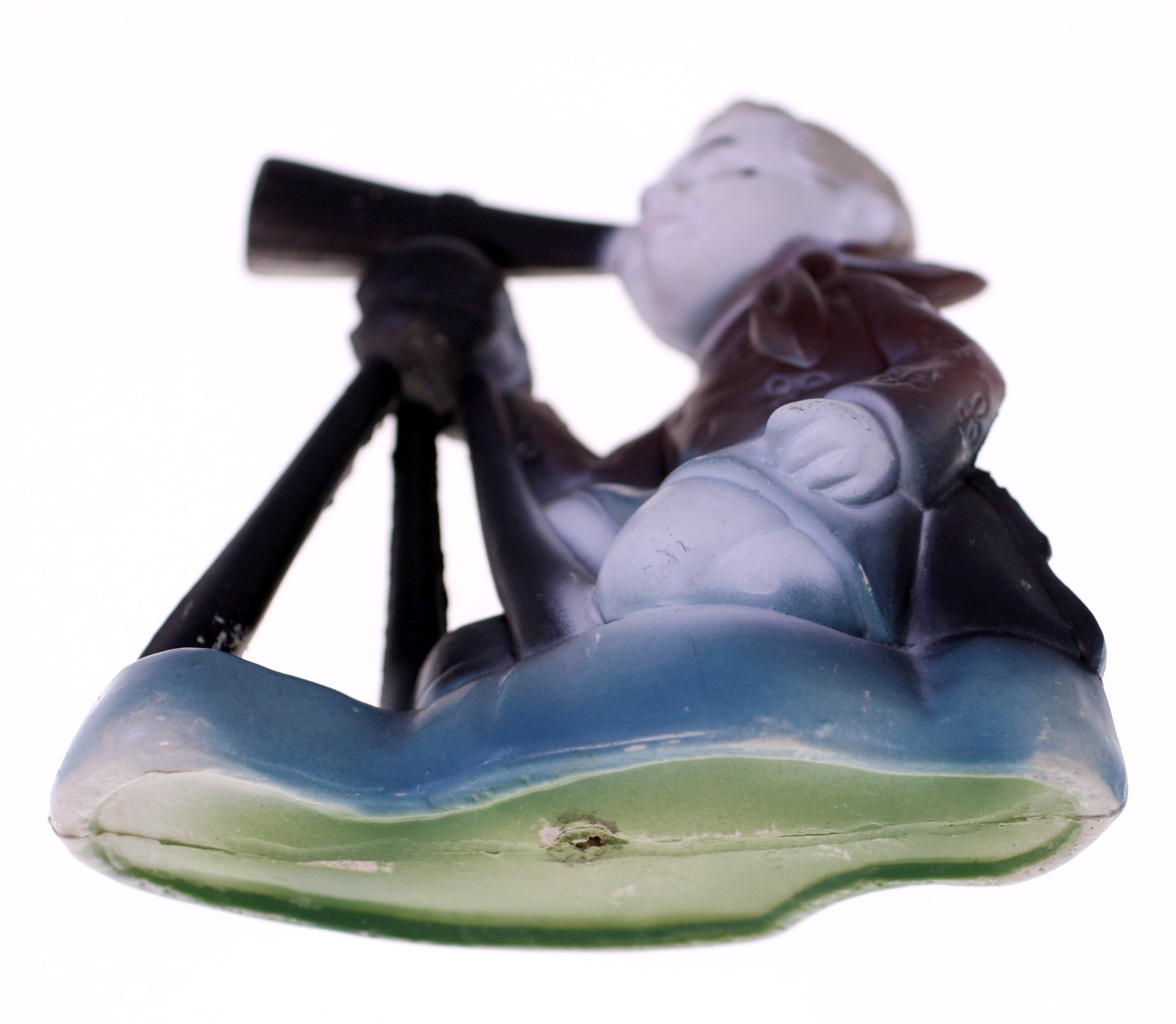 Art glass figurine of a child/cherub with telescope or spyglass