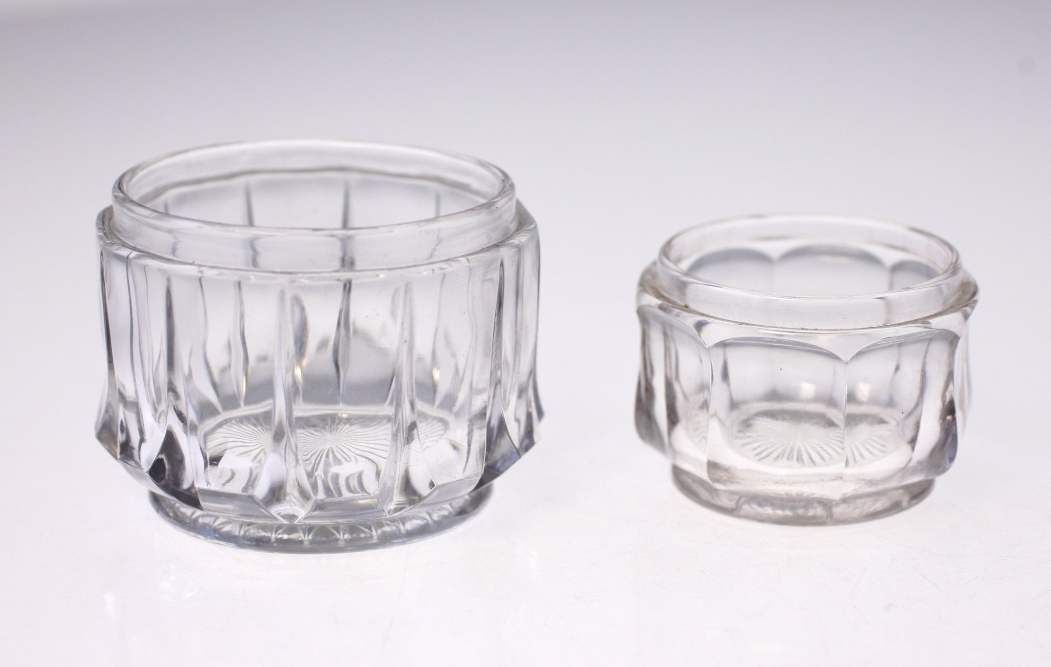 Pair of clear pressed-glass open salt cellars / small condiment dishes
