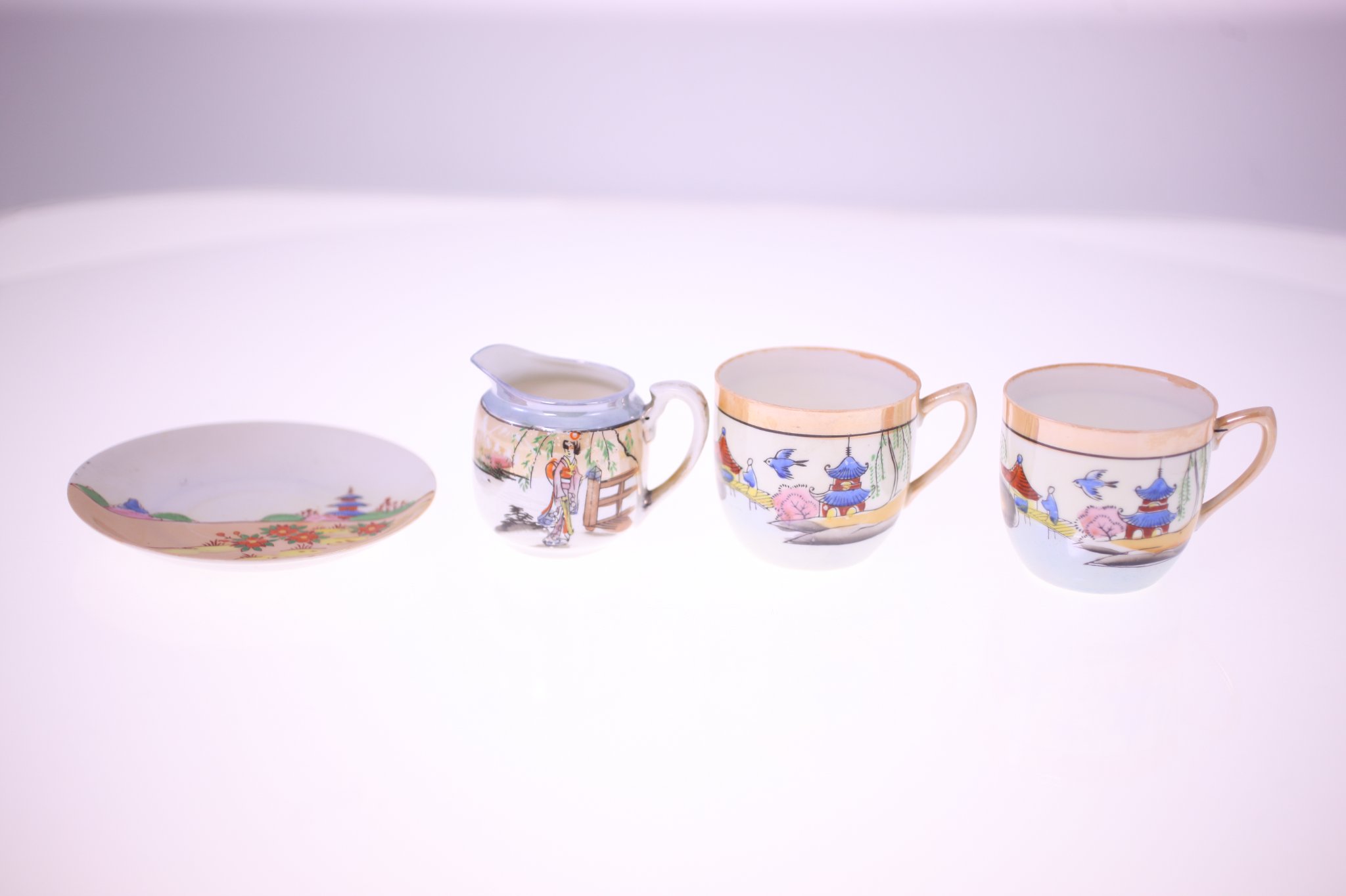 Japanese porcelain tea service set (small pitcher/creamer, cups, and saucer)
