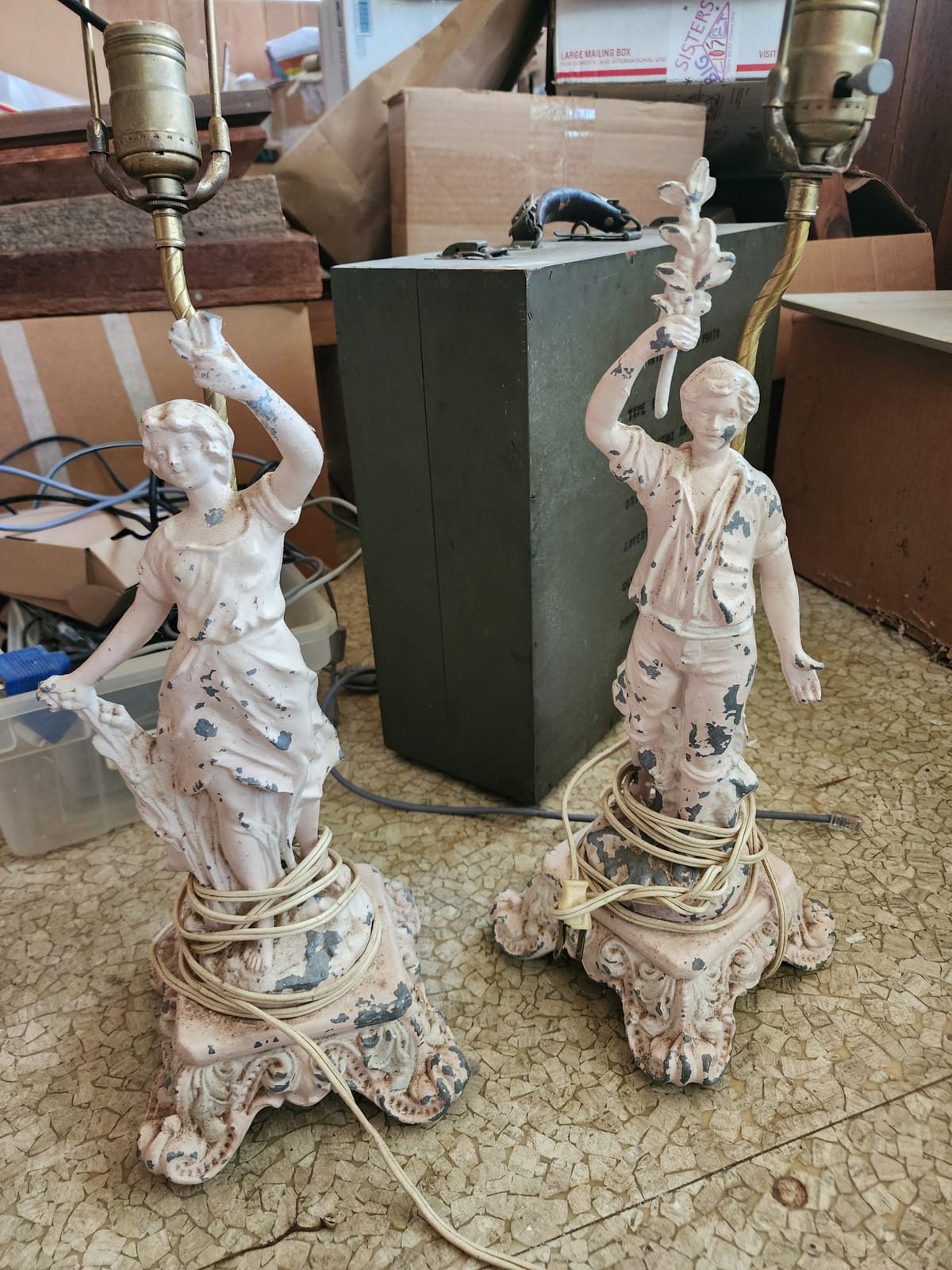 Pair of cast metal figural table lamps with female and male classical figures